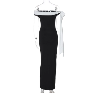 Detail of slimming off-shoulder monochrome maxi dress on mannequin showing fabric texture