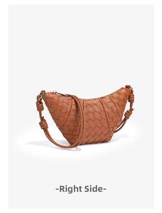 Detail of hand-woven brown crescent bag with premium leather texture and knotted strap