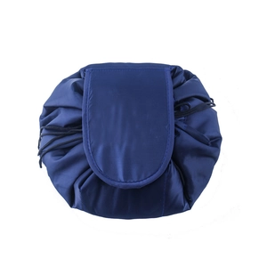 Closed view of blue drawstring makeup bag made of durable oxford fabric with top flap
