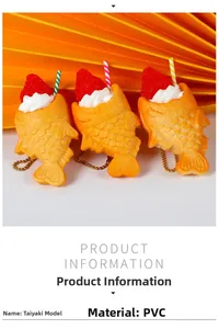 Close-up of artificial Taiyaki keychains with cream, strawberry, and gold chains