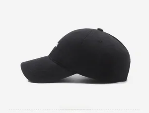 Side view of black cotton baseball cap showing fine twill texture and white embroidery