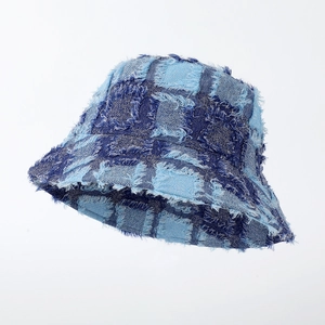Detail showing checkered denim patchwork and frayed edges on the trendy bucket hat