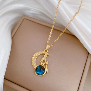Starry moon queen necklace in gold with zircon accents on a beige jewelry box