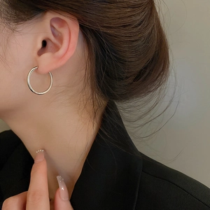 Minimalist silver geometric hoop earrings for women with a polished mirror finish