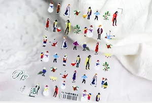 Detail of ultra-thin nail art stickers featuring winter cartoon characters and snowmen
