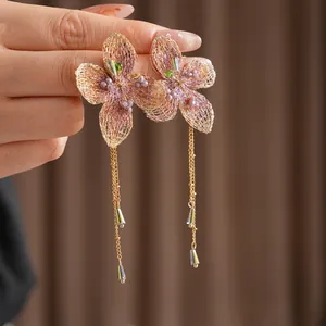 Vintage style floral drop earrings with long gold tassels and purple beaded crystal accents
