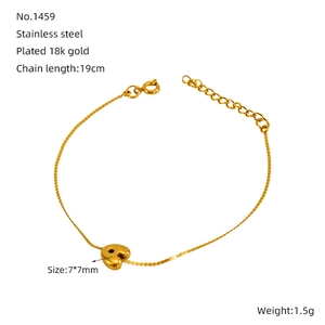 Detail of 18K gold plated heart charm and 19cm stainless steel bracelet links
