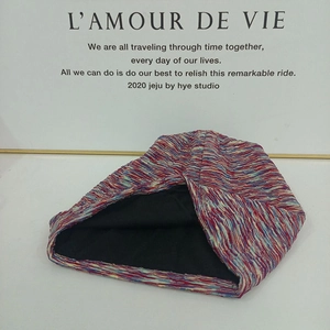 Thick knit slouchy beanie with colorful mixed-yarn texture and warm black soft lining