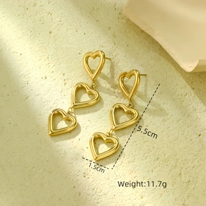 Detail view of 18K gold heart earrings showing 5.5cm length and 11.7g weight info