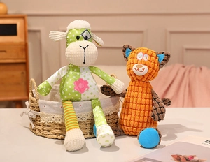 Detail of plush animal toys in woven basket showing soft textured fabric and embroidery