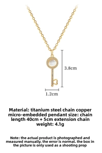 Detailed size specifications for gold key necklace with opal and sparkling cubic zirconia