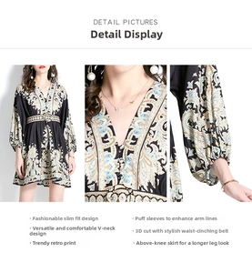Detail view of V-neckline, puff sleeves, and waist tie on vintage floral mini dress