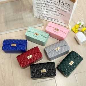 Chic jelly handbags in candy colors featuring diamond lattice patterns and gold twist locks