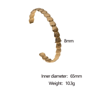 Detail of 8mm golden C-shaped bangle showing textured fish scale pattern and dimensions
