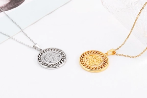 Detailed view of hollow Hamsa Hand pendant in gold and silver finish stainless steel