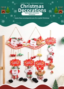 Close-up of fabric Christmas hanging ornaments with Santa and reindeer motifs