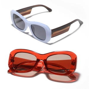 Stylish square frame sunglasses with white rims, patterned temples and red lenses