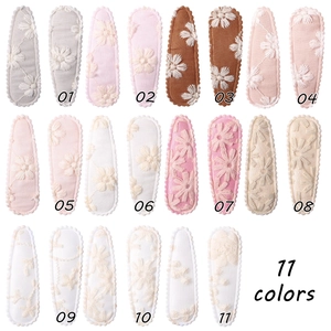 Detailed set of floral embroidered snap clips in eleven different pastel color options