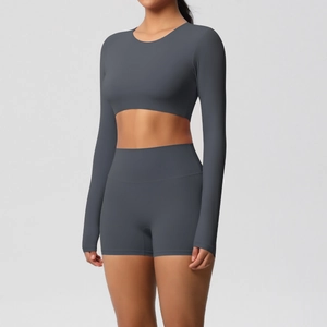 Detail view of charcoal grey long sleeve crop top and high waist sports shorts set
