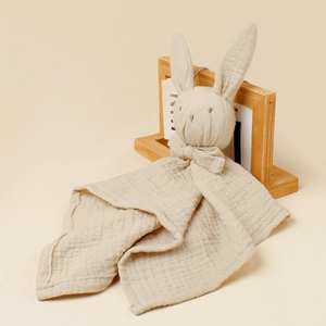 Beige cotton muslin baby security blanket with a cute stuffed rabbit head design