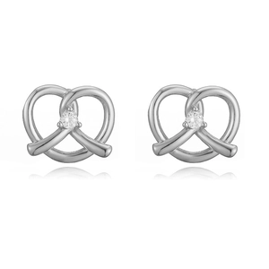 Detailed view of silver bow-shaped stud earrings with sparkling central zircon inlay