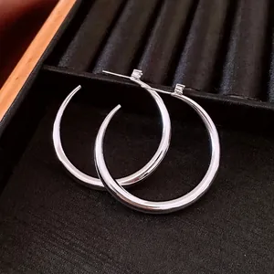 Polished 18k gold plated silver geometric hoop earrings with zircon accents in box