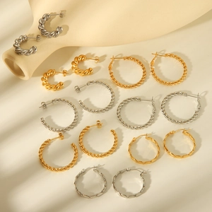 Twisted C-shaped hoop earrings in gold and silver stainless steel varying sizes