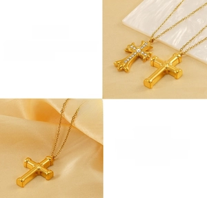 Detail of gold-plated stainless steel cross pendants with cubic zirconia inlay and polish