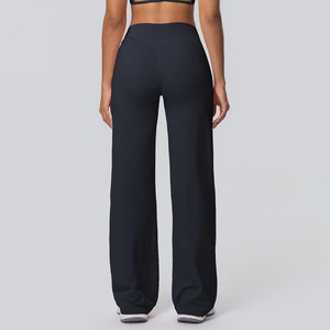 Rear view of high waist wide leg black yoga pants showing the loose fit and soft fabric