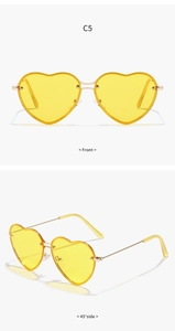 Front and 45-degree side views of yellow heart-shaped metal sunglasses with gold frame