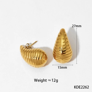 Detailed view of golden leaf earrings with texture and dimensions of 27mm by 15mm