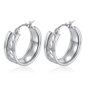 Detailed view of silver hoop earrings with a sophisticated textured braided pattern finish