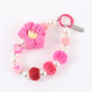 Pink plush flower and pearl phone charm with heart beads and Good Luck tag