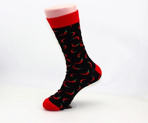 Detail of mid-calf socks with red chili patterns and contrasting red heel and toe