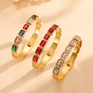 Titanium steel gold bangles with colorful rectangular crystals and wavy edge details