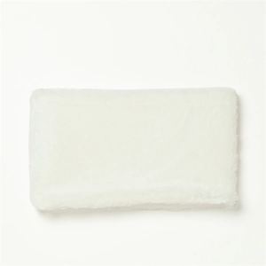 Detailed close-up of soft white faux rabbit fur texture on a warm winter neck warmer