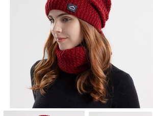Detail of red cable-knit winter hat and neck warmer set with Sport mountain logo patch