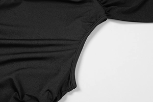 Macro detail of the smooth stitching and texture on black bodycon dress fabric