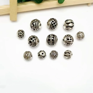 Vintage Tibetan silver hollow round spacer beads with intricate Celtic and floral patterns