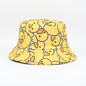 Close-up of yellow cotton bucket hat featuring all-over cartoon duck print detail