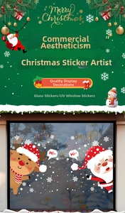 Close-up of Santa Claus and reindeer UV window stickers with Merry Christmas text