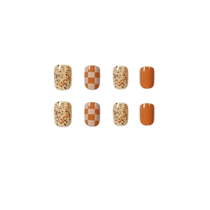 Glossy orange and beige checkerboard press-on nails in a natural short square shape