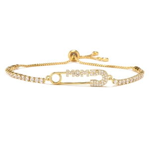 Detailed view of adjustable gold-plated MOM bracelet with micro-pave cubic zirconia crystals
