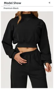 Detail of high-waisted drawstring joggers and cropped hoodie in black sporty fabric