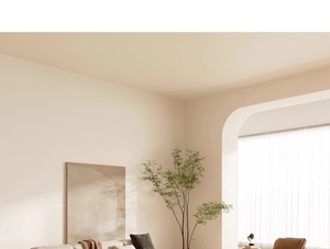Modern minimalist living room corner with a warm beige sofa and waterproof floor mat
