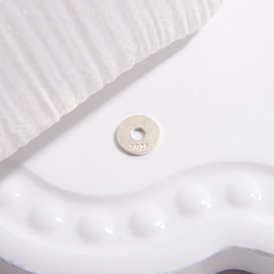 Macro view of S925 sterling silver spacer beads with authentic hallmark for jewelry