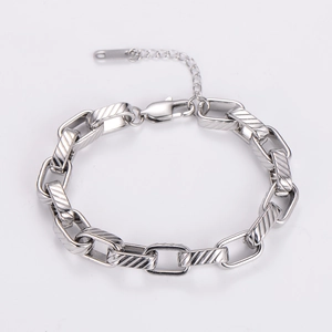 Detailed view of silver stainless steel chain link bracelet with lobster clasp and extender