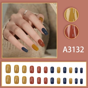 Fall press-on nails set with 24 pieces in mustard yellow, caramel brown and navy blue colors