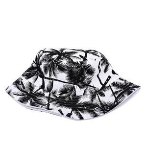 Reversible bucket hat with black and white palm tree print for sun protection