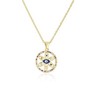 Macro detail of 18K gold plated evil eye pendant with colorful cubic zirconia and blue enamel